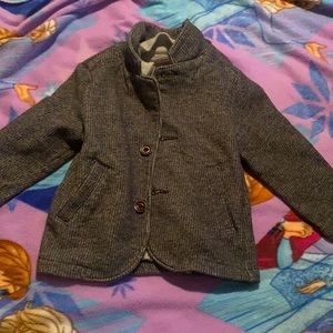 Warm and cozy jacket with zipper and buttons
